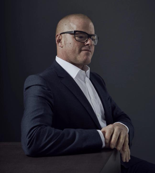 heston blumenthal wears glasses in a suit