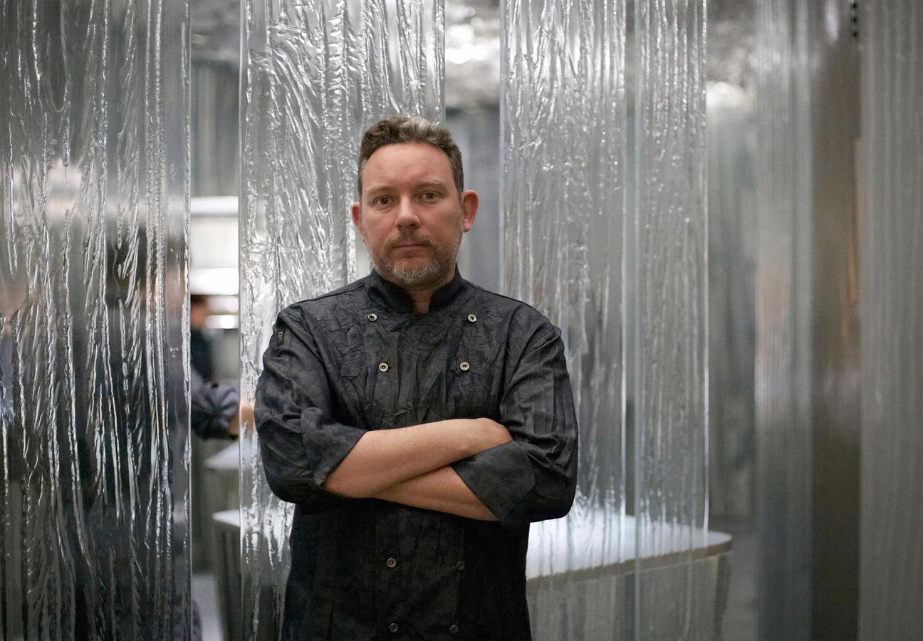 Chef Albert Adria standing in his restaurant Enigma