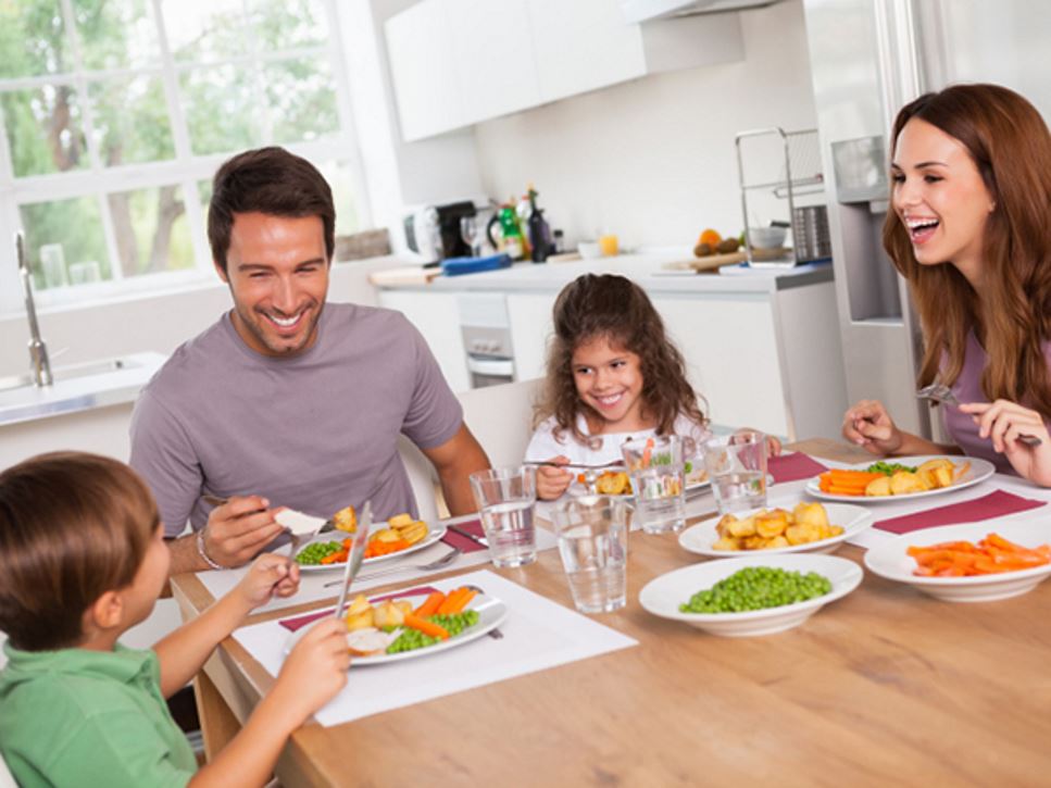 Family enjoying a healthy meal together - Make Your Kid's Meal a MyPlate Superstar