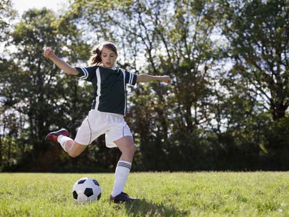 Girl Playing Soccer - Teen Nutrition for Fall Sports
